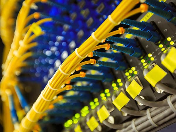 Business Connectivity Features 600x450 Yellow cable wires plugged into equipment